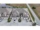 Aerial view of townhouses with tile roofs, parking, and landscaping at 17094 Acapulco Rd # 313, Punta Gorda, FL 33955