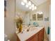 Bright bathroom with single vanity and decorative accents at 17094 Acapulco Rd # 313, Punta Gorda, FL 33955