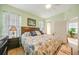 King-size bed, wood furniture, and beach themed decor at 17094 Acapulco Rd # 313, Punta Gorda, FL 33955