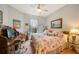 Bedroom with king-size bed, work space, and water views at 17094 Acapulco Rd # 313, Punta Gorda, FL 33955