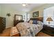 King-size bed, wood furniture, and beach themed decor at 17094 Acapulco Rd # 313, Punta Gorda, FL 33955