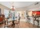 Bright dining area with glass-top table and four chairs at 17094 Acapulco Rd # 313, Punta Gorda, FL 33955