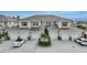 Two-story building, attached garages, and palm trees at 17094 Acapulco Rd # 313, Punta Gorda, FL 33955
