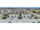 Tan two-story townhouses with tile roofs, two-car garages, and landscaped yards at 17094 Acapulco Rd # 313, Punta Gorda, FL 33955