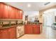 Modern kitchen with granite countertops and wood cabinets at 17094 Acapulco Rd # 313, Punta Gorda, FL 33955