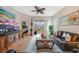 Living room with leather sofas, coffee table, large TV and access to balcony at 17094 Acapulco Rd # 313, Punta Gorda, FL 33955
