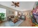 Spacious living room with leather couches, coffee table, and large TV at 17094 Acapulco Rd # 313, Punta Gorda, FL 33955