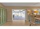 Bright dining room with large windows offering views of the pool at 18646 Kerrville Cir, Port Charlotte, FL 33948