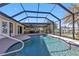 Stunning pool and lanai with water view at 18646 Kerrville Cir, Port Charlotte, FL 33948