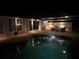 Inviting pool and lanai area at night at 18646 Kerrville Cir, Port Charlotte, FL 33948