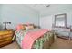 Bedroom with coral bedding and built-in dresser at 2002 Bal Harbor Blvd # 1822, Punta Gorda, FL 33950