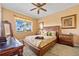 Spacious bedroom with wood furniture and water view at 2002 Bal Harbor Blvd # 1822, Punta Gorda, FL 33950
