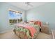 Bedroom with coral bedding and large window at 2002 Bal Harbor Blvd # 1822, Punta Gorda, FL 33950