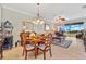 Bright dining room with table, chairs and view to living room and lanai at 2002 Bal Harbor Blvd # 1822, Punta Gorda, FL 33950