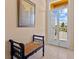 Bright and airy entryway with a bench and view to a patio at 2002 Bal Harbor Blvd # 1822, Punta Gorda, FL 33950