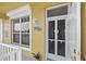 Front door entrance with a screen door, showing a welcoming entry to the home at 2002 Bal Harbor Blvd # 1822, Punta Gorda, FL 33950
