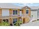 Building exterior showing entrance and stairs with attractive landscaping at 2002 Bal Harbor Blvd # 1822, Punta Gorda, FL 33950