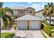 Two-story building with attached garages, showcasing a well-maintained exterior at 2002 Bal Harbor Blvd # 1822, Punta Gorda, FL 33950