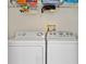 Laundry room with washer, dryer, and shelving at 2002 Bal Harbor Blvd # 1822, Punta Gorda, FL 33950