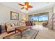 Living room with comfy seating, large window, and balcony access at 2002 Bal Harbor Blvd # 1822, Punta Gorda, FL 33950