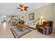 Open living space with seating area and view into dining area at 2002 Bal Harbor Blvd # 1822, Punta Gorda, FL 33950