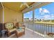 Peaceful screened balcony with canal view and wicker furniture at 2002 Bal Harbor Blvd # 1822, Punta Gorda, FL 33950