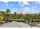Community tennis court with lush landscaping at 2002 Bal Harbor Blvd # 1822, Punta Gorda, FL 33950
