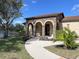 Community clubhouse with stone facade and arched entryway at 2108 La Palma Ave, Port Charlotte, FL 33953