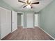 Bedroom with double closets and laminate floors at 21150 Gertrude Ave # O-2, Port Charlotte, FL 33952