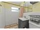 Simple bathroom with white tile and a dark vanity at 22126 Gatewood Ave, Port Charlotte, FL 33952