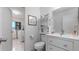 Bright bathroom with toilet and sink, laundry access at 22278 Vick St # A100, Punta Gorda, FL 33980