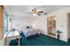Bedroom with ensuite bathroom and teal carpet at 22278 Vick St # A100, Punta Gorda, FL 33980