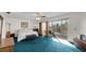 Bright bedroom with a large bed and access to a balcony at 22278 Vick St # A100, Punta Gorda, FL 33980