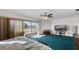 Spacious bedroom with balcony access and teal carpeting at 22278 Vick St # A100, Punta Gorda, FL 33980
