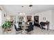 Dining area with glass table, chairs, and access to the living room at 22278 Vick St # A100, Punta Gorda, FL 33980