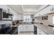 Modern kitchen with granite countertops and stainless steel appliances at 22278 Vick St # A100, Punta Gorda, FL 33980