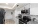 Kitchen with stainless steel appliances and granite countertops at 22278 Vick St # A100, Punta Gorda, FL 33980