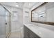 Modern bathroom with gray vanity and walk-in shower at 22481 Vale Ave, Punta Gorda, FL 33980