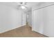 Simple bedroom with wood-look floors and double doors at 22481 Vale Ave, Punta Gorda, FL 33980