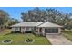 Single story home with metal roof and garage at 22481 Vale Ave, Punta Gorda, FL 33980