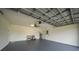Attached garage with ceiling fan and extra storage at 22481 Vale Ave, Punta Gorda, FL 33980