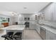 Modern kitchen with gray cabinets, marble countertops, and stainless steel appliances at 22481 Vale Ave, Punta Gorda, FL 33980