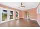 Bright sunroom featuring brick flooring and French doors at 22481 Vale Ave, Punta Gorda, FL 33980