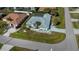 Aerial view of single-Gathering home with a pool and landscaped yard at 23176 Lindale Ave, Port Charlotte, FL 33954