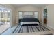 Guest bedroom with a queen bed and access to a patio at 23176 Lindale Ave, Port Charlotte, FL 33954