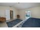 Bedroom with queen bed and direct access to pool at 23176 Lindale Ave, Port Charlotte, FL 33954