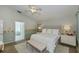 Bright bedroom with king-size bed and en-suite bathroom at 23176 Lindale Ave, Port Charlotte, FL 33954