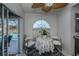 Cozy breakfast nook with small table and chairs, near pool access at 23176 Lindale Ave, Port Charlotte, FL 33954