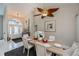 Bright dining room featuring a wood table and ceiling fan at 23176 Lindale Ave, Port Charlotte, FL 33954