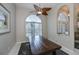 Bright dining room with large table, ceiling fan, and access to backyard at 23176 Lindale Ave, Port Charlotte, FL 33954